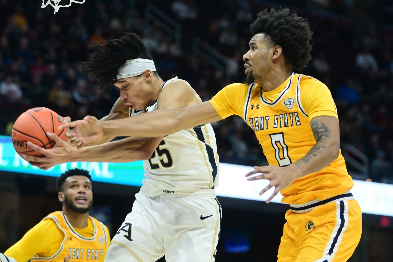 Akron forward Enrique Freeman and Rollins during the Zips’ 62-61 win over Kent State in the MAC tournament championship on March 16, 2024.